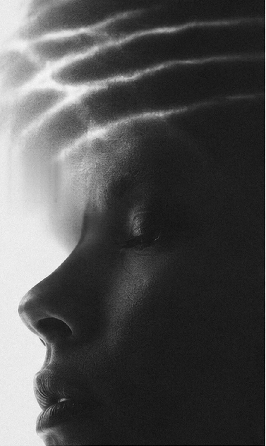 A person in profile, eyes closed, light rippling across their forehead